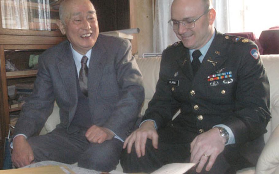 Maj. Frank Clark, Army liaison officer to Japan’s East Army, sits with Mamory Oba in his home near Sendai, where Clark is based. As the sole U.S. Army representative in the area, he is a liaison officer and acts as the representative for Gen. Elbert Perkins, USARJ commanding general.