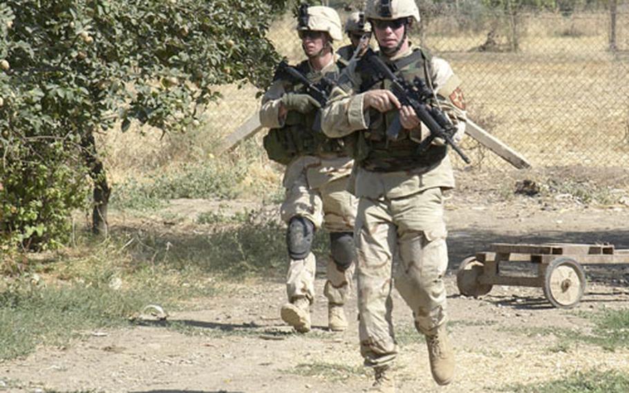 Soldiers search for weapons caches in Mosul, Iraq. The Army has sent a team of medical workers to Iraq to help soldiers fight combat stress. The combat stress teams are hoping that soldiers will become more willing to seek help if they need it.