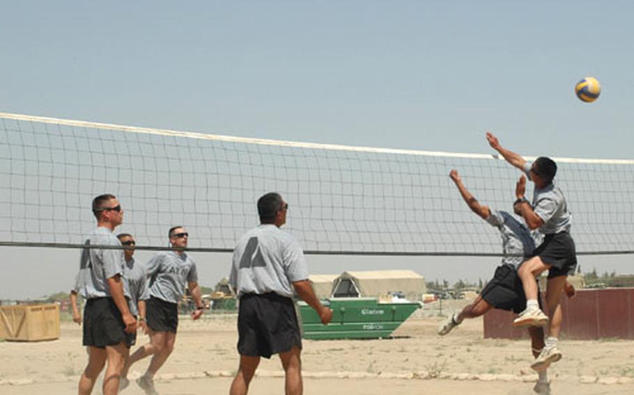 Soldiers playing volleyball downrange.