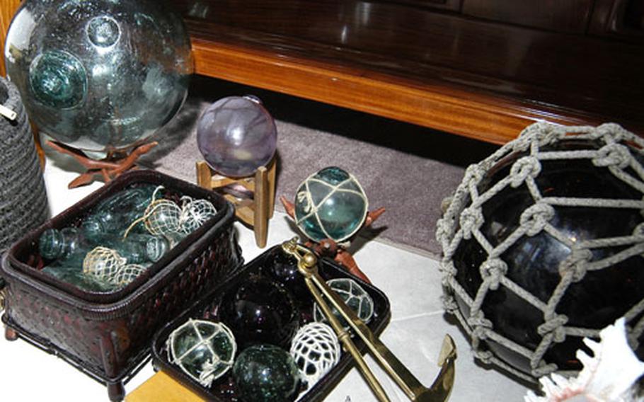 Some of Chief Aviation Maintenance Administrationman John Herreria's glass fishing floats in his home at the Naval Air Station Sigonella Maranai Housing area. Herreria has been collecting glass fishing floats since 1997 from around the world.