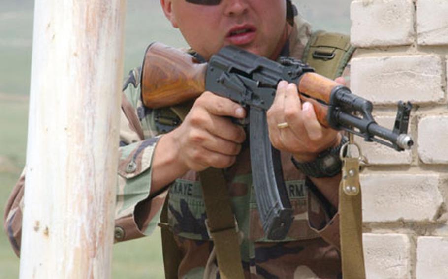 Sgt. Joel Kaye, a military police investigator with the 88th MP detachment at Camp Zama, provides security for soldiers during an exercise earlier this month in Mongolia.