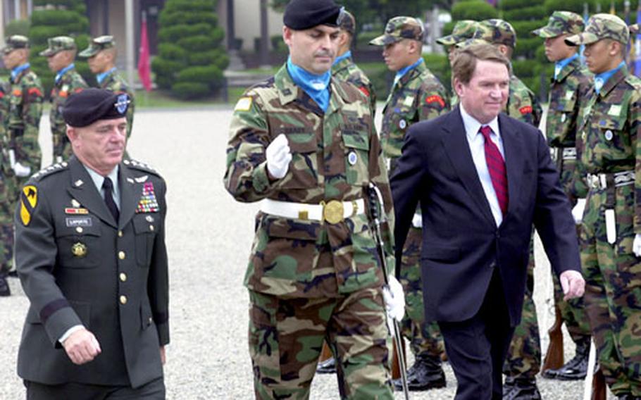 U.S. Ambassador to South Korea Thomas C. Hubbard, right, walks with U.S. Forces Korea commander Gen. Leon J. LaPorte and an honor guard soldier Tuesday during a farewell ceremony at Yongsan Garrison.