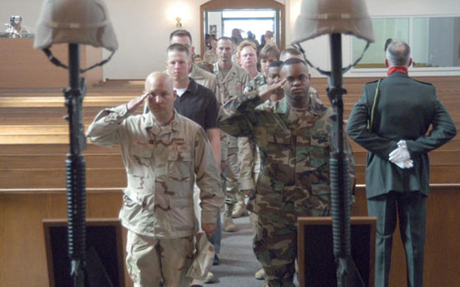 Soldiers give final salutes to Spc. Nicholas J. Zangara and Pfc. Nicholas H. Blodgett, following a memorial service in Schweinfurt, Germany on Thursday. The 1st Infantry Division soldiers were killed in Iraq on July 24.