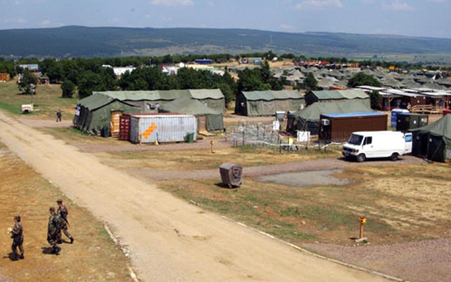 Soldiers walk across part of the Bulwark 04 base camp Saturday at the Novo Selo Training Area, Bulgaria. The 141-tent camp, which took six weeks to construct, is the first combined training exercise in Bulgaria since the country joined NATO in May.