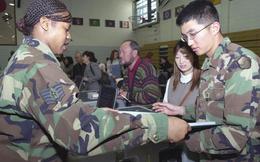 Cpl. Jun Y.B., pictured here last year helping during a NEO drill at Yongsan Garrison, is one of thousands of KATUSAs assigned to U.S. Army units in South Korea.