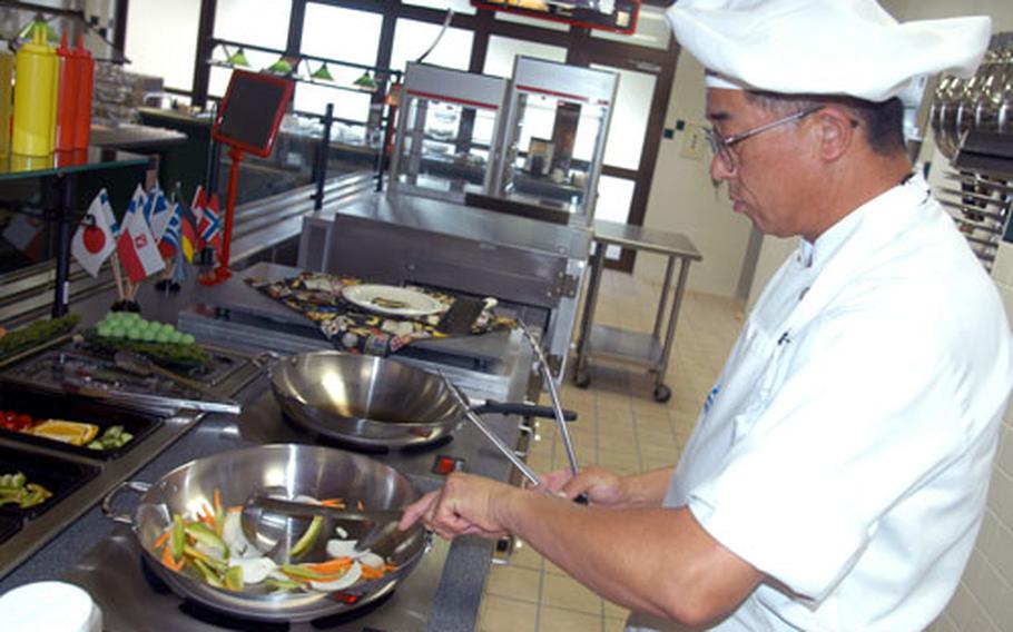 Head chef Ebina Takeshi whips up some Mongolian barbecue at Grissom Dining Facility's new wok station.