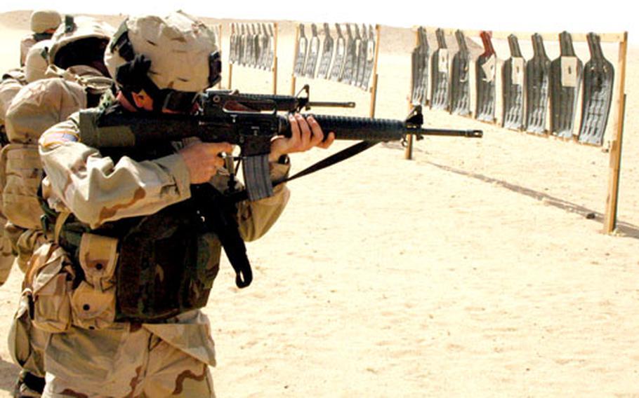 Soldiers from the 2nd Forward Support Battalion, who arrived from South Korea last week, fire at moving targets on Udairi Range, Kuwait.