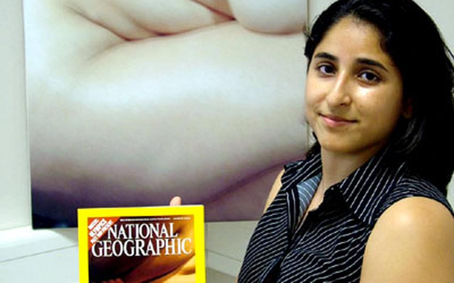Leslie Cervantes, wife of Army Sgt. Jose Cervantes of the 52nd Signal Battalion in Stuttgart, Germany, was shocked to see the August cover of National Geographic, which nearly replicates a photo she took four years ago that has been shown at art shows in the United States and Germany.