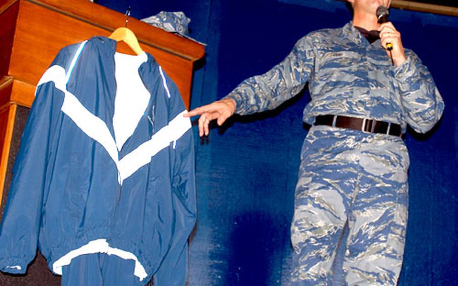 PACAF Command Chief Master Sgt. David Popp, wearing the service’s new blue BDUs, shows off the Air Force’s proposed physical training uniform: a blue sweat suit with reflective material, shorts and a gray T-shirt. Popp talked Friday to enlisted troops at Misawa Air Base, Japan. He’s been visiting Air Force bases in Okinawa and Japan wearing what’s expected to be the new Air Force utility uniform.