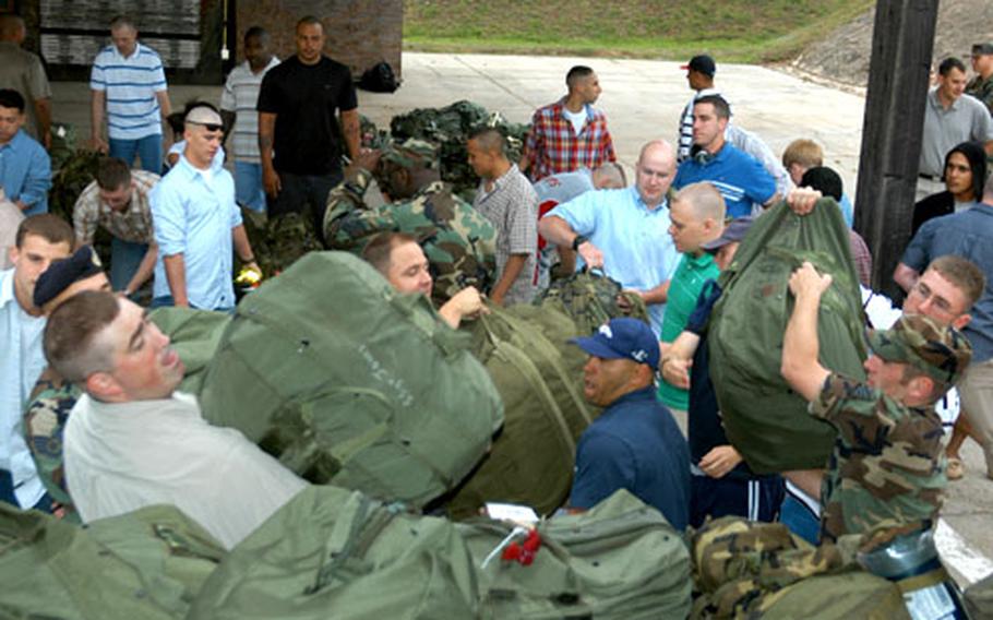 Members of the 52nd Security Forces Squadron of Spangdahlem Air Base, Germany, load gear onto a truck Monday as they get ready to deploy for at least six months as part of the next Aerospace Expeditionary Force rotation.