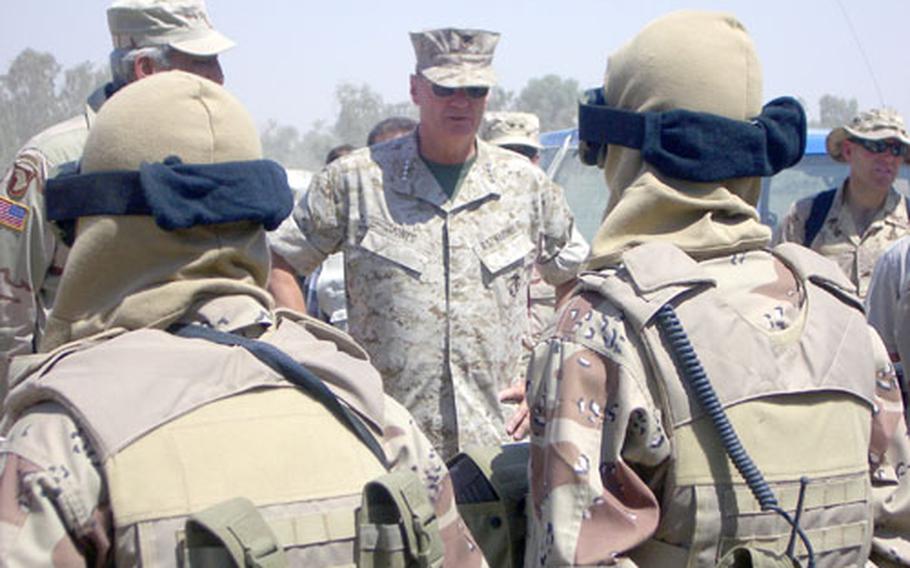 U.S. Marine Gen. James Jones, commander of Supreme Headquarters Allied Powers Europe, talks to Iraqi Special Forces under training by the Multinational Forces during a recent tour of Iraq. About 40 NATO members are now in Baghdad to train senior Iraqi officials.