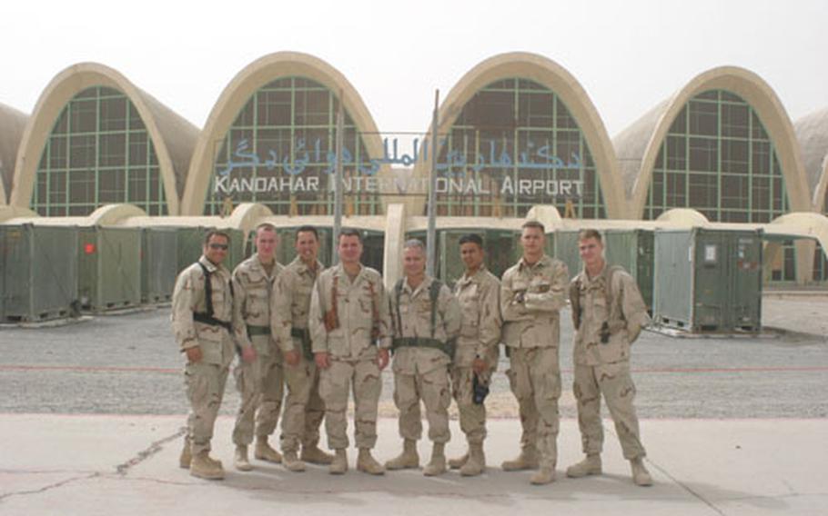 Sailors from Misawa's Fleet Maritime Patrol Mobile Operational Control Center-Western Pacific pose for a photo while deployed to Kandahar, Afghanistan.