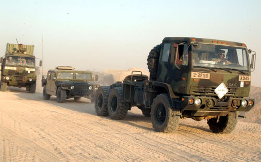 Soldiers from the 2nd Foward Support Battalion reach the end of an exhausting three-day convoy to their new home in Iraq.
