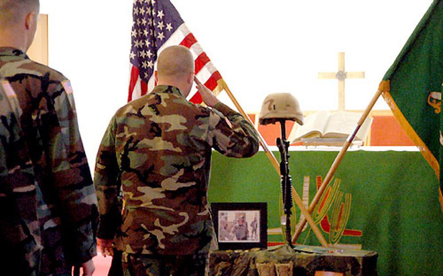 A soldier gives a final salute to 1st Lt. Timothy E. Price at his memorial service in Giessen. Price was killed in Iraq on Tuesday.