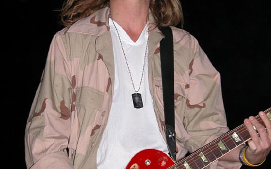 Puddle of Mudd’s singer and guitarist, Wesley Scantlin, rocks the crowd at Camp Speicher Sunday night.