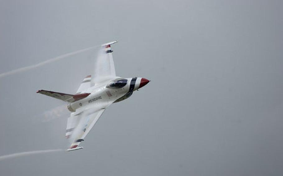 One of the Thunderbirds flight demonstration team, piloted by Maj. Todd Canterbury, flies over the crowd at Sunday's Osan Air Base air show.