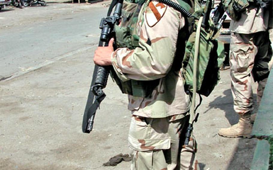 Soldiers from Company C patrol Haifa Street on Sunday.