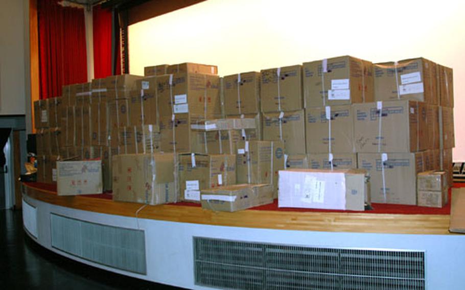 Boxes containing new theater chairs for Sasebo Naval Base&#39;s Showboat Theater fill the stage Tuesday afternoon. The theater is undergoing a $425,000 renovation.