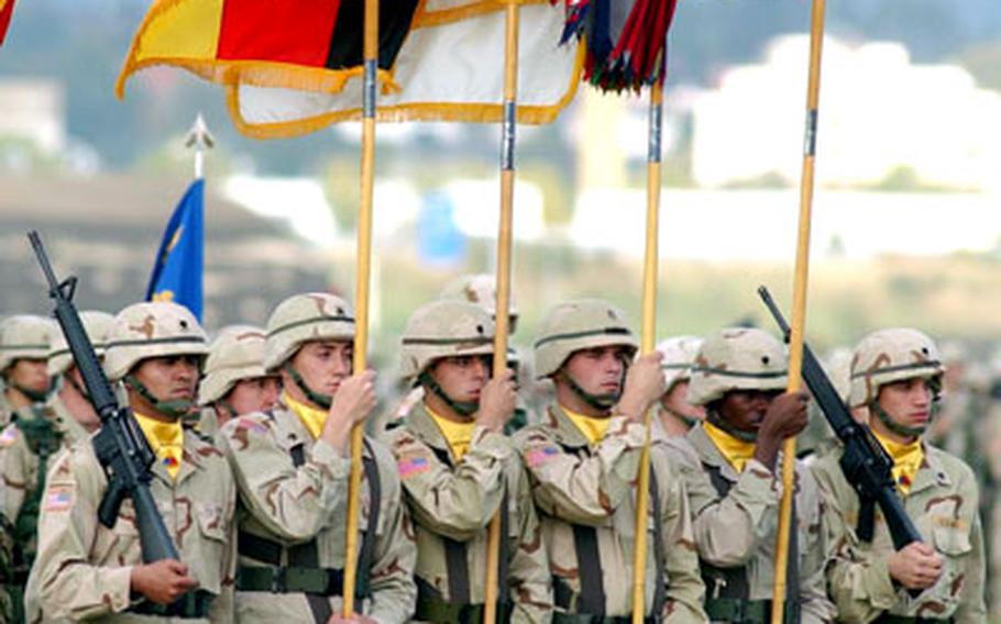 The 1st Armored Division color guard, during the official welcome home ceremony for the 1st AD in Wiesbaden, Germany, on Thursday. Deputy Secretary of Defense Paul Wolfowitz; American ambassador to Germany Dan Coats; Supreme Allied Commander Europe Marine General James Jones; Army Chief of Staff Gen. Peter Schoomaker; and U.S. Army Europe commander Gen. B.B. Bell were among the guests at the ceremony.