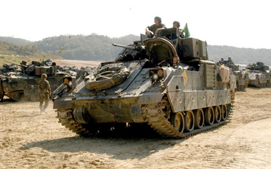 Bradley crews from 4th Squadron, 7th Cavalry Regiment wait to begin live-fire training at Rodriguez Range, South Korea, on Friday.
