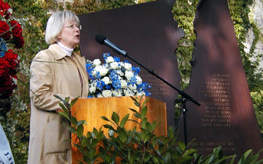 Lord Mayor Gudrun Grieser of Schweinfurt, Germany, stands among memorial wreaths in front of a monument commemorating the soldiers and civilians killed on “Black Thursday,” the epic Oct. 14, 1943, U.S. air raid on the city’s ball-bearing plants. About 200 Germans and Americans — including 14 veterans of the bombing raid by the 8th Air Force of the U.S. Army Air Force, and several German survivors — attended Thursday’s friendship ceremony on the 61st anniversary of the attack.