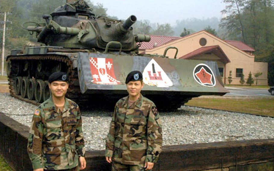 Sgt. Lee Kang Hoon, 30, of Seoul, left, and 2nd Lt. Charity Rico, 28, of Virginia Beach, Va., are serving with 2nd Infantry Division’s Engineers Brigade at Camp Howze.