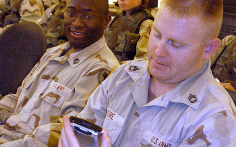 Sgt. 1st Class Sean Moore, with the 12th Battalion, 104th Division from Fort Lewis, Wash., completes the computerized medical questionnaire as part of his unit’s Deployment Cycle Support at the LSA Anaconda Personnel Processing Center.