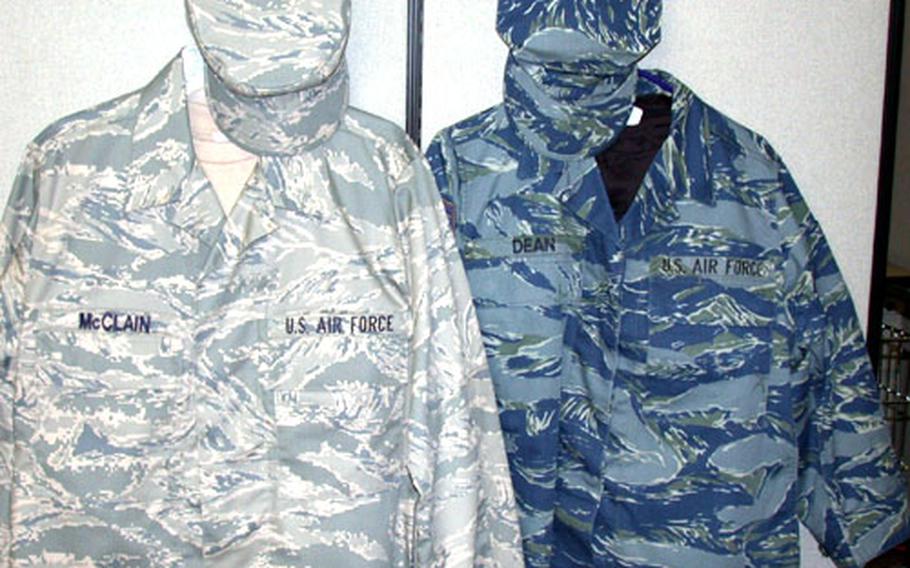 The new Air Force test uniform, with a subdued digital tiger-stripe pattern, is on the left. The original test colors, on the right, proved to be "too distinctive" for airmen who offered their opinions, Air Force officials said.