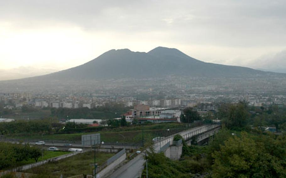 On a clear day, above, Mount Vesuvius can be seen towering over Naples, Italy but smog often hides the volcano, as shown below. If you live in Naples, you’re breathing in the equivalent of nine to 11 cigarettes’ worth of pollution per day, according to a recent medical study.