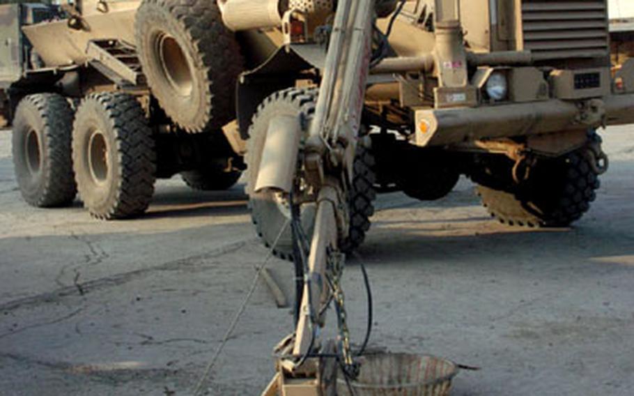 The South African-developed Buffalo, called “Al Jamoose” in Arabic, can pick up and examine explosives. It’s built to withstand a massive explosion and is a new tool in the Army’s anti-bomb arsenal.