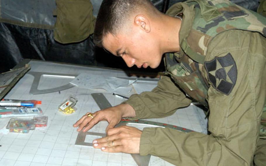 Pvt. Trinity Phomsopha, 19, of Fort Smith, Ark., uses a "battleaxe" to calculate the distance and deflection of a Paladin shot into Rodriguez Range.