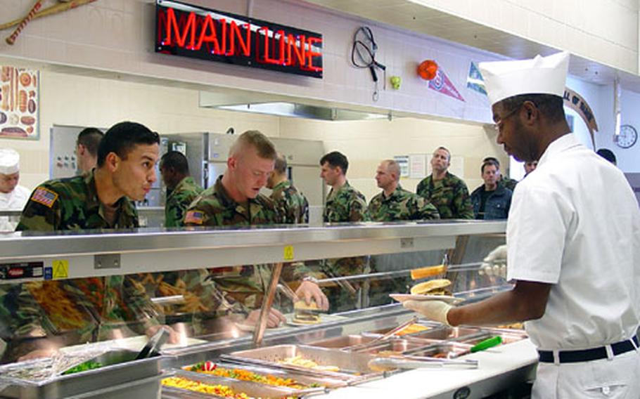 A worker fills a lunch order at the 1st Battalion, 4th Infantry Regiment&#39;s dining facility in Hohenfels, Germany.