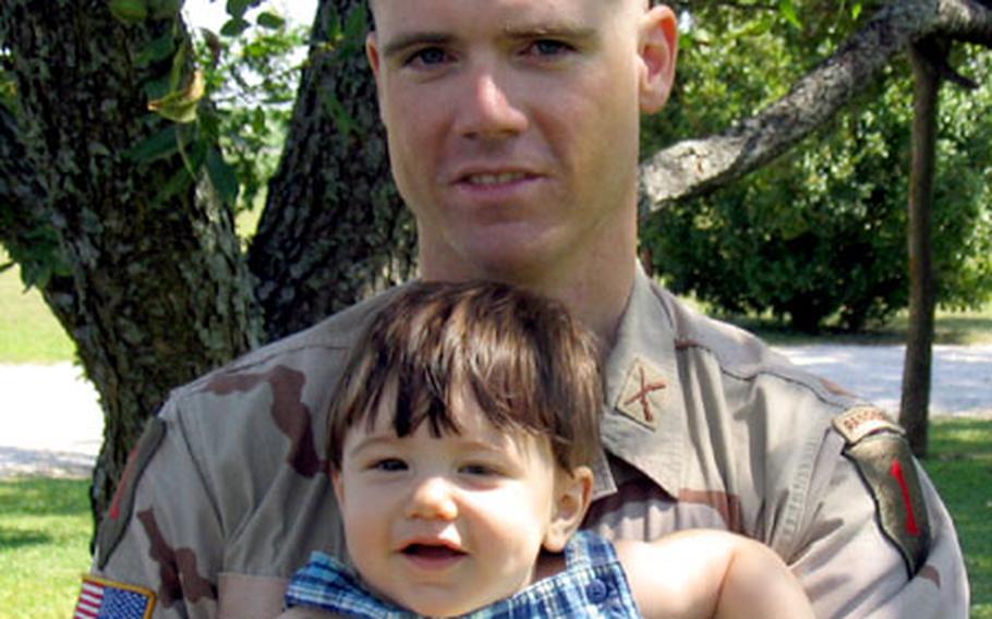 Capt. Sean Sims, pictured with his young son, Colin.