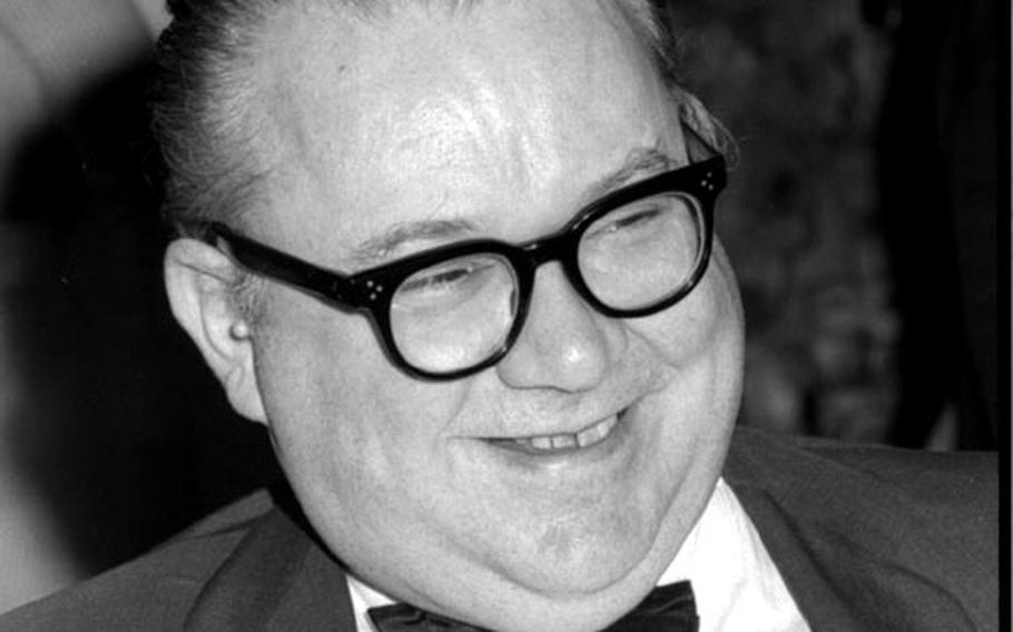 Walt Kelly, creator of the "Pogo" comic strip, relaxes in Frankfurt on his way to Vietnam in August, 1965.