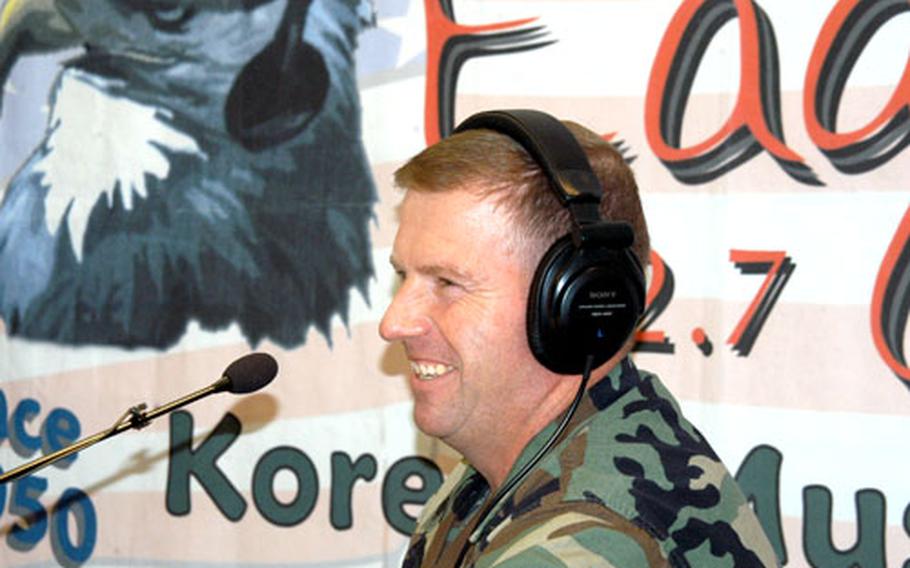 Sgt. Major Kenneth O. Preston, the top-ranking enlisted soldier in the Army, takes questions from callers Wednesday afternoon on Eagle 102.7 FM in Seoul.