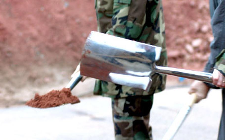 Brig. Gen. Rosanne Bailey, commander of the 435th Air Base Wing at Ramstein Air Base, helps break ground Friday for the Kaiserslautern Military Community Center Friday with members of a joint U.S.-Germany delegation. The 729,000-square-foot, $150 million hotel and shopping center is the largest single construction project in the Department of Defense.