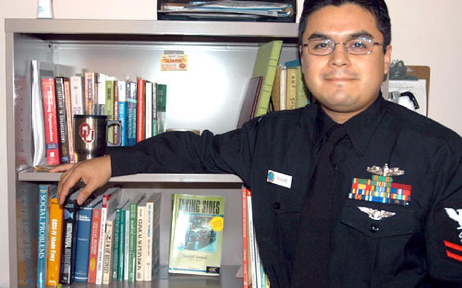 Petty Officer 2nd Class Elias Sanchez, 32, is near earning a Master's Degree in human relations from the University of Oklahoma's satellite campus in Naples, Italy. He praised Navy leaders' efforts to make higher education a priority for sailors, saying the complexity of today's world really requires sailors to get college-level degrees.