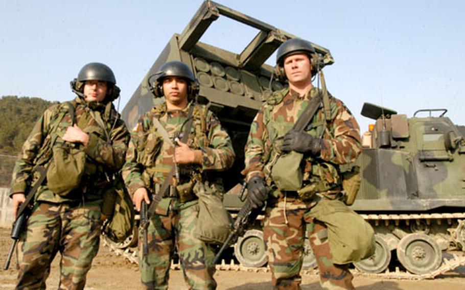 Sixth Battalion, 37th Field Artillery Regiment soldiers Pfc. Michael Volze, left, Sgt. Kenneth Marrero, center, and section chief Staff Sgt. Joshua Manfull are among 2nd Infantry Division artillermen at Rodriguez Range, South Korea, who plan to celebrate their patroness, St. Barbara, on Friday with a St. Barbara’s Day ball.