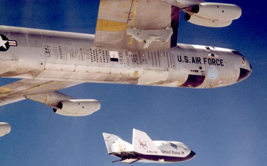 The X-38 research vehicle drops away from NASA’s B-52B mothership after it’s released from the B-52’s wing pylon in July 1999. After nearly 50 years of service with NASA, the B-52 is being retired and will be put on display at Edwards Air Force Base, Calif. The markings under the wing of the B-52B are a history of all the vehicles the plane has launched.