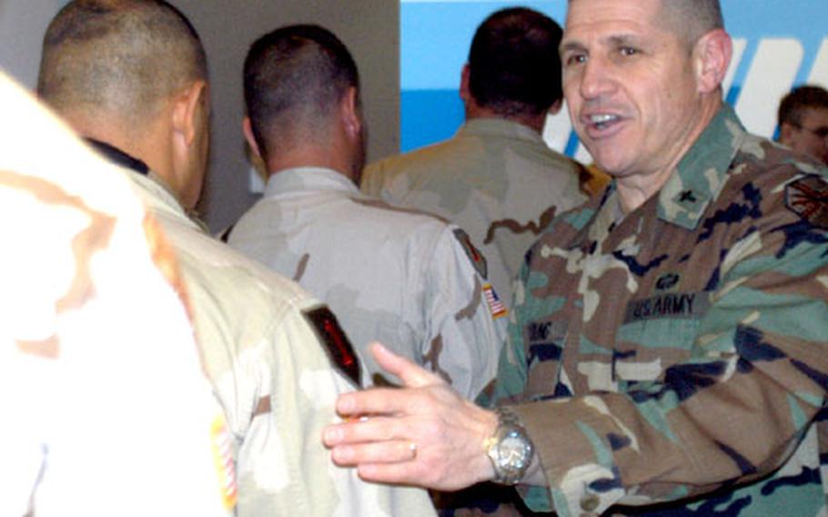 Army Chaplain (Maj.) Sid Young, who is with the Nevada National Guard and deployed to Rhein-Main Air Base, Germany, greets troops coming back from a rest and recouperation trip to the States. Before he stopped counting in November, Young had greeted more than 250,000 troops and civilians at the base. Young is looking into getting a permanent position within the U.S. Army Europe so he can do what he loves.