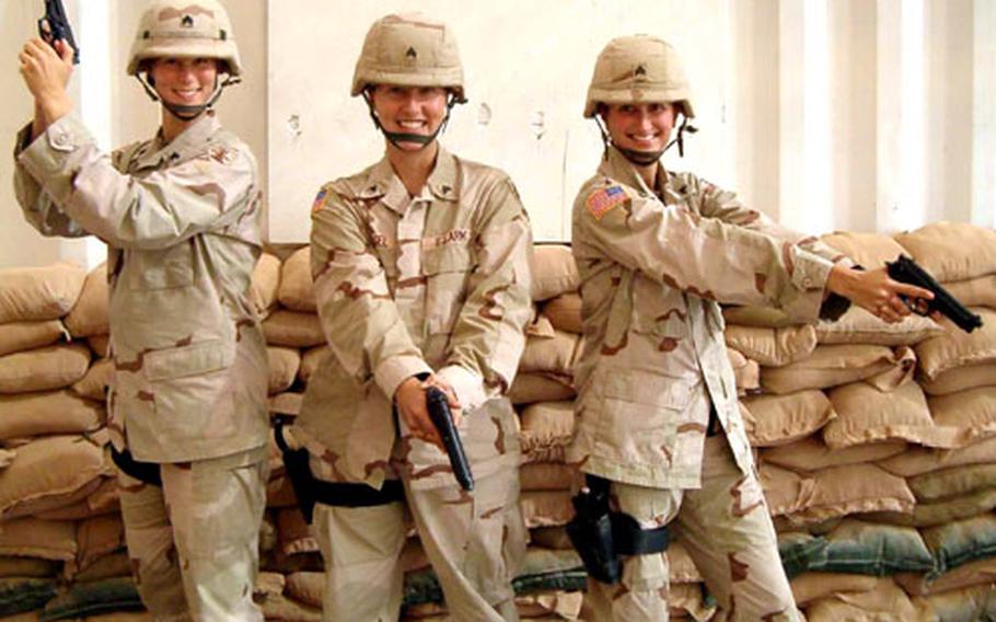 Medics, from left, Sgt. Angela Magnuson, Sgt. Kristen Pagel and Sgt. Jessica Fisher have a little fun posing as Charlie’s Angels at Forward Operating Base Warhorse, near Baqoubah, Iraq. The soldiers are with Company C, 141st Engineer Combat Battalion.