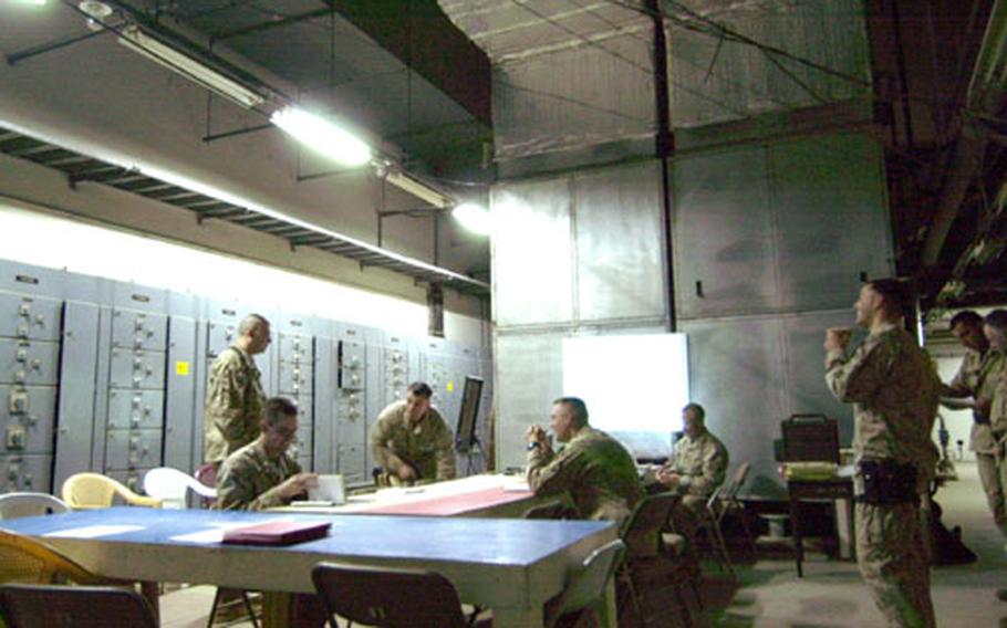 Marines of the 1st Battalion, 23rd Marine Regiment have converted giant open areas in the dam into conference rooms and other facilties.