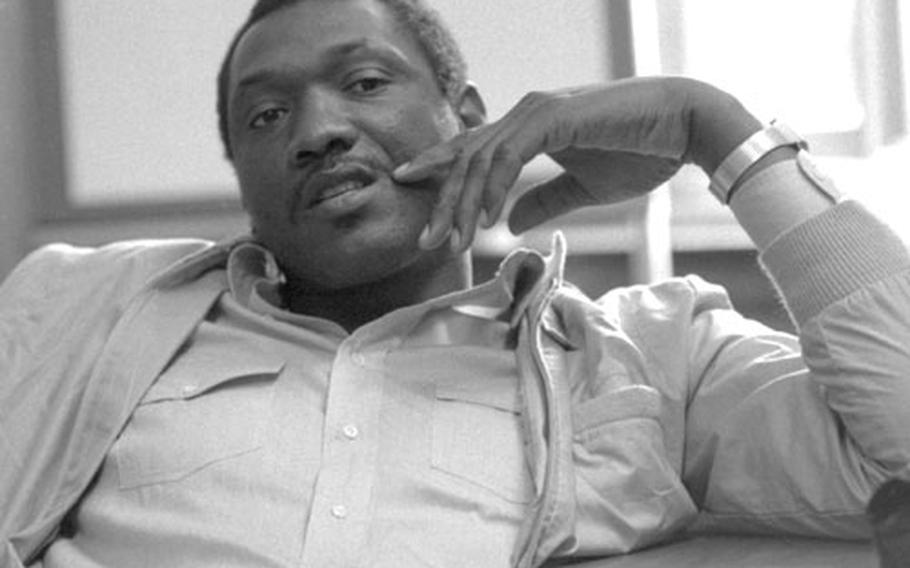 Elvin Hayes relaxes during an interview.