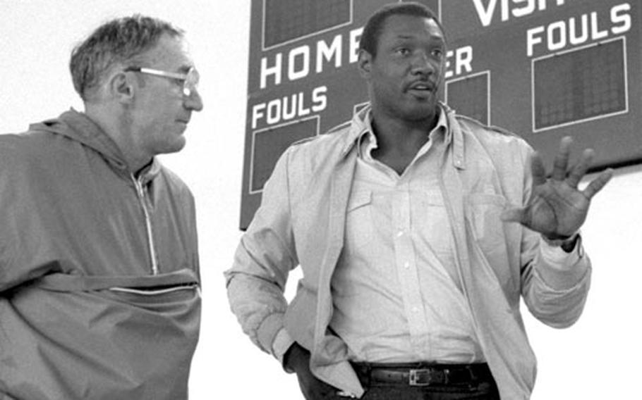 Elvin Hayes talks with Wayne Warren, physical activities director at the Cambrai-Fritsch Kaserne gym in Darmstadt, Germany.