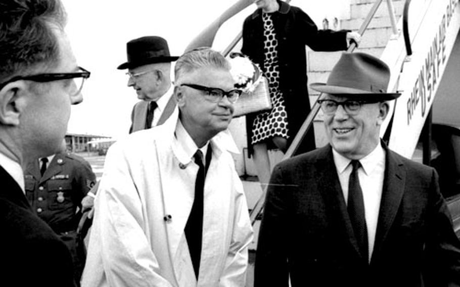 Chief Justice Earl Warren of the U.S. Supreme Court, right, arrives in Germany in May, 1966.