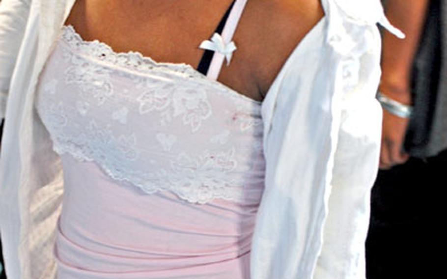 Ramstein High School will start making students who wear shirts like this — with spaghetti straps — cover them with baggy T-shirts. Boys who wear baggy pants will be made to wear suspenders.