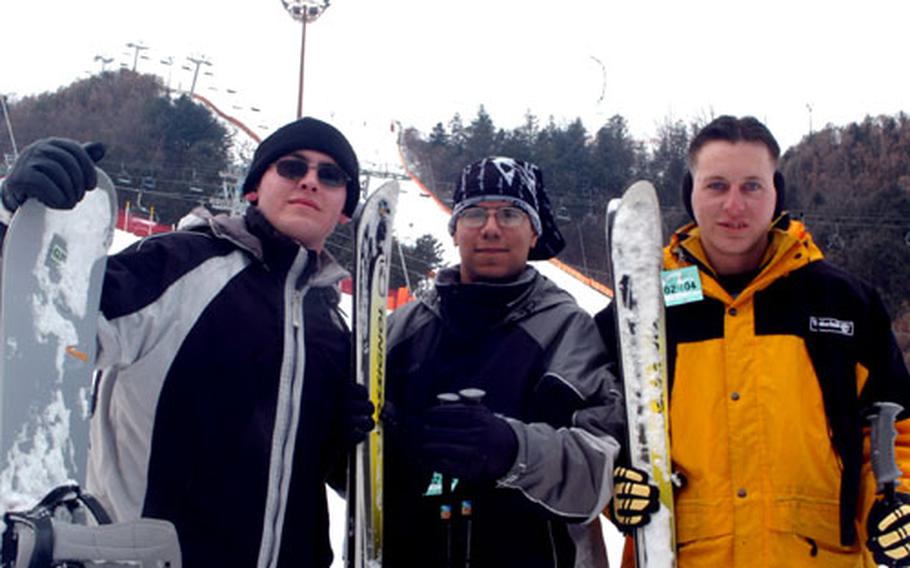 Camp Stanley soldiers, from left, Pvt. Robert James, Pfc. Manuel Romo and Pfc. John Essig take a break Friday from hitting the slopes at South Korea's Gangchon Resort ski area.