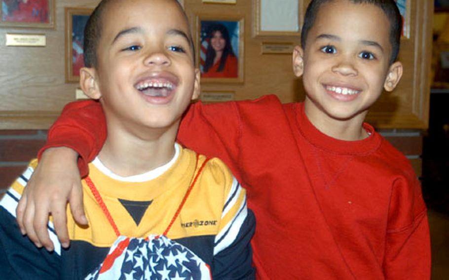 Darius Sims, 6, left, and his brother, Marion, 8, miss their father, Tech. Sgt. Damien Sims, who is deployed with the 48th Security Forces Squadron at RAF Lakenheath, England. The two boys have joined the Kids Deployment Zone, a new program at the base for children of deployed parents.