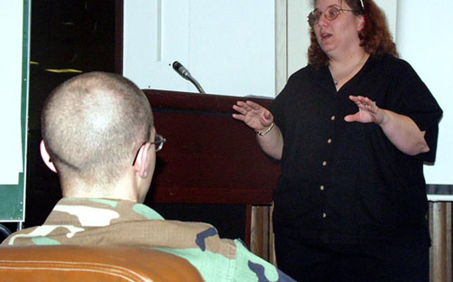 Jo Sperry, the Army Family Advocacy educator, speaks to nine single parents during the 32nd Signal Battalion all-day conference Friday at the Army Community Service Office in Darmstadt, Germany.