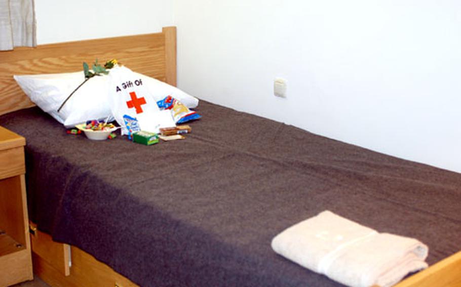 Donated items sit on a bed in the Battery C, 1st Battalion, 6th Field Artillery Regiment barracks Monday in Bamberg, Germany. Family members put together care packages and made the beds for single soldiers expected to return from Iraq in the next few weeks.